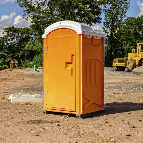 what is the cost difference between standard and deluxe portable restroom rentals in Harpersfield